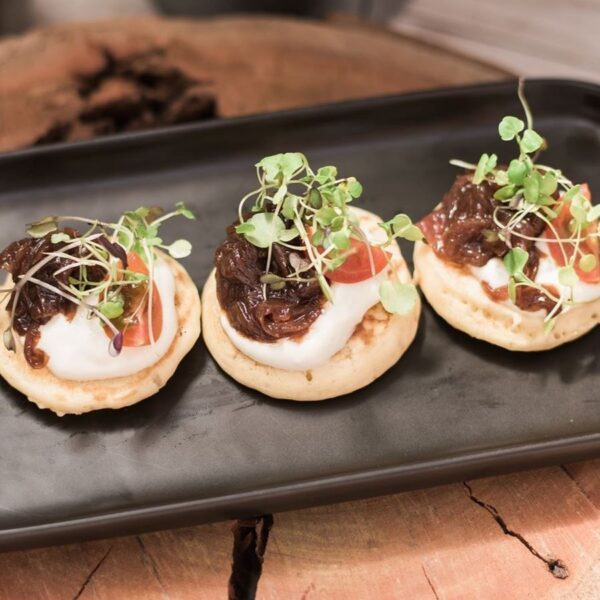 Blinis with red onion confit, crème fraîche & chives Signature Cold Canape