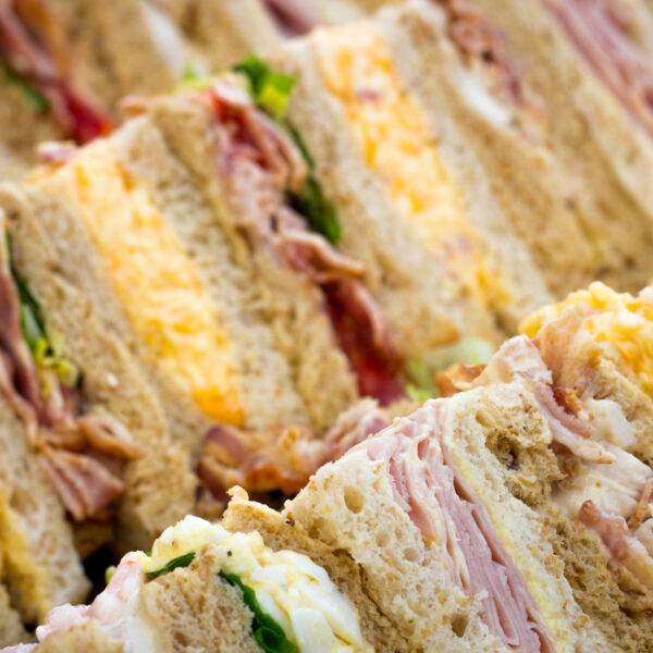 One bite petite pressed egg sandwiches - whole egg mayonnaise, relish cut into crustless bites