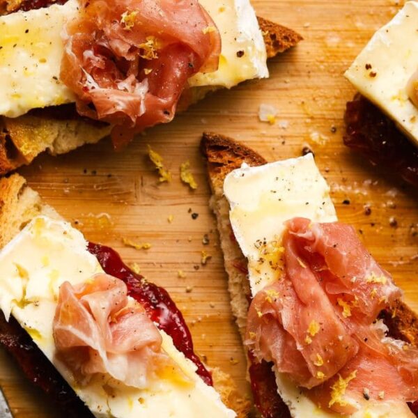 Fig jam with shaved prosciutto and brie, roasted garlic crostini