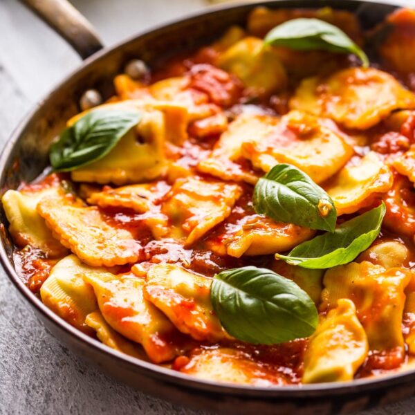 Pumpkin ravioli with tomato, basil sauce