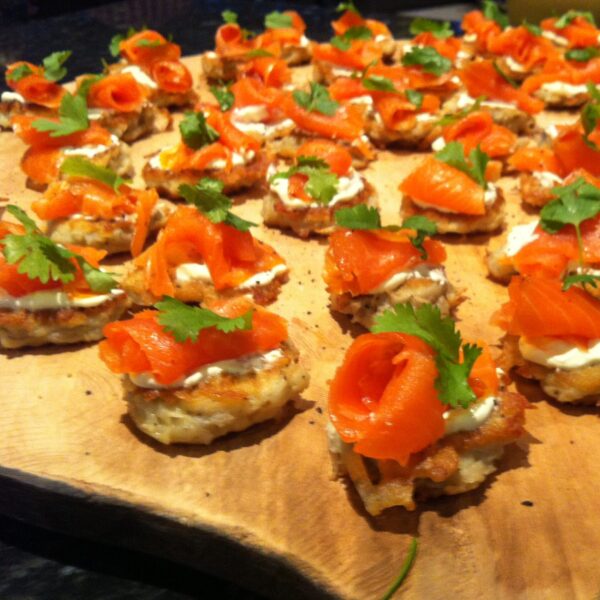 Citrus salmon avocado ceviche on corn tortilla and topped with micro herb (gf) (df)