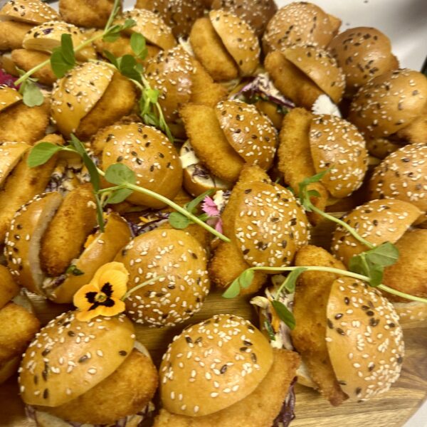 Brioche mini burger bun with crisp chicken and chipotle mayo slaw